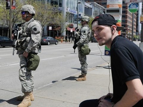 Protesters defy curfew in riot-hit Baltimore