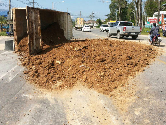 Soil truck flips, spills load over busy Phuket road